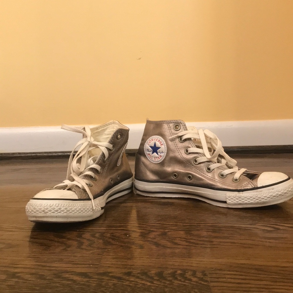 Gently worn gold converse high top sneakers
